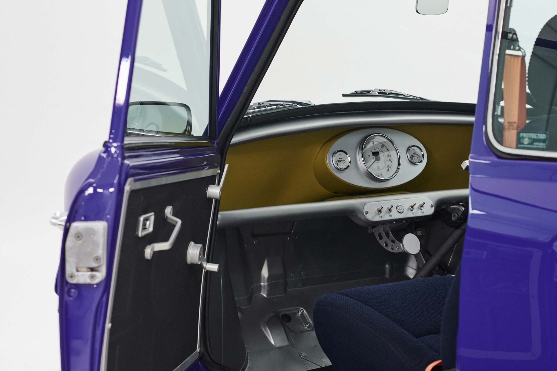 Inside view of the open MINI Recharged model with a view of the dashboard.